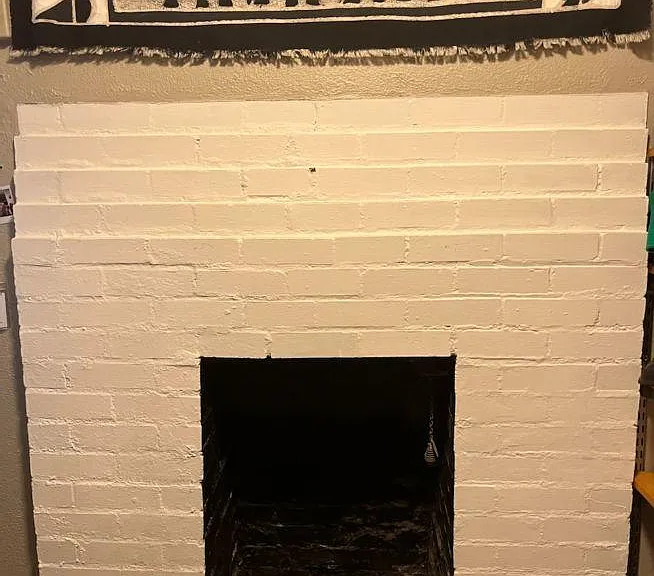 Decorative fireplace in the bedroom/family room in the lower level.