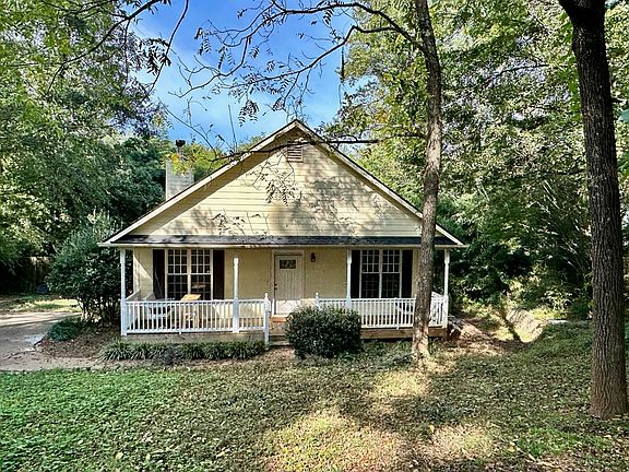Front porch with two swing sets and ceiling fans for relaxation