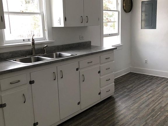Kitchen with new linoleum floors. Big eat in kitchen with lots of light.