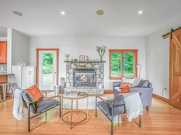 Fireplace seating area, opening onto back year - full open plan living