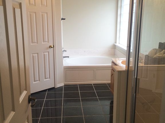 Master bathroom with separate shower and tub