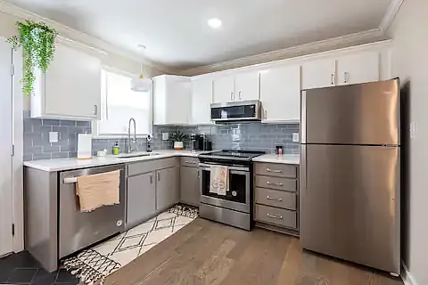 Filly remodeled kitchen that comes fully appointed. Coffee maker, Microwave, large sink and newer appliances. - 220 Woodsborough Pl