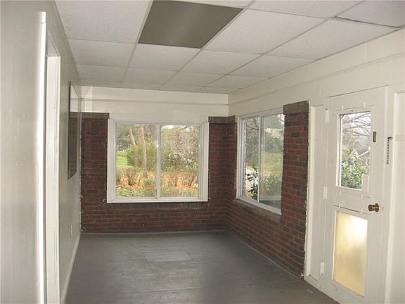 Enclosed sunroom in the front of the home.