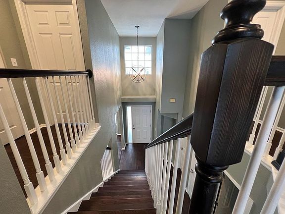 Stairs and entry area from the upper level.