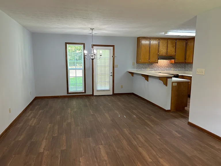 Front door looking into living, dining, and kitchen