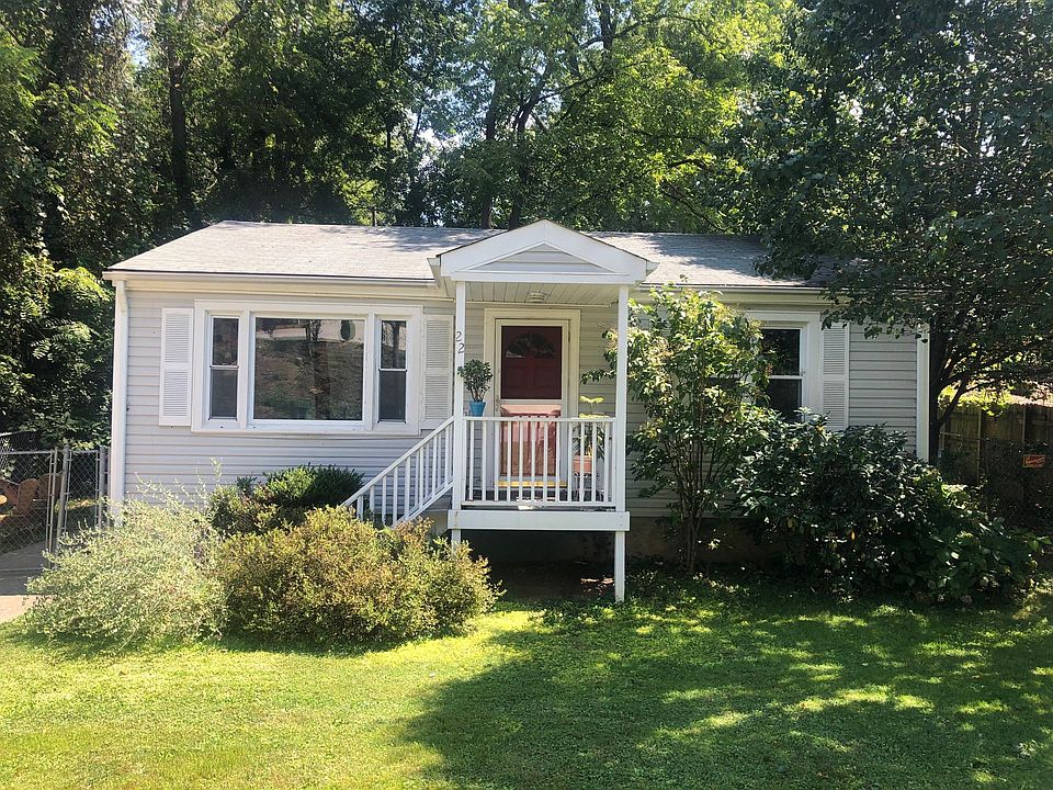 Front of the house. The community garden is to the right as you face the house.