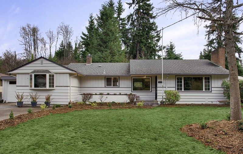 Front of house, note 1 car garage on far left.