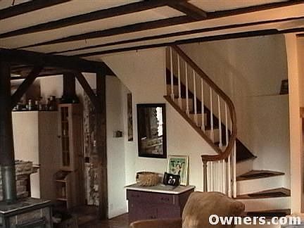 Living room w/ stairs