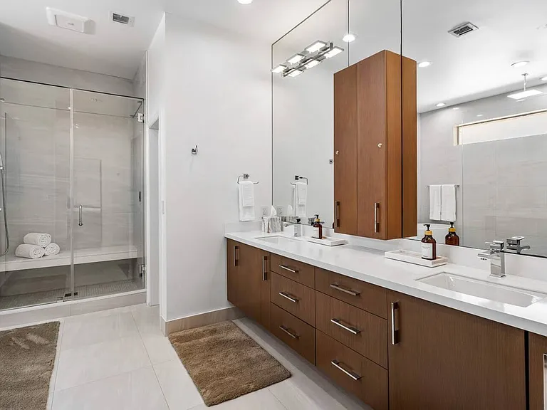 Sleek cabinetry, and ample lighting for a refreshing start to your day.