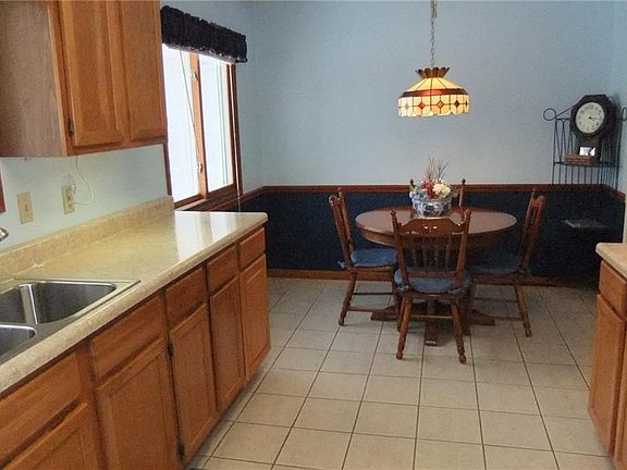 Dining area of kitchen. Ceramic tile flooring.
