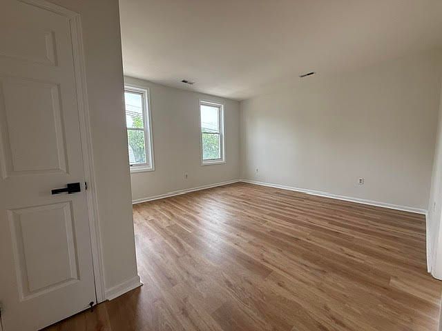 main gathering room, new flooring and paint, bright natural light