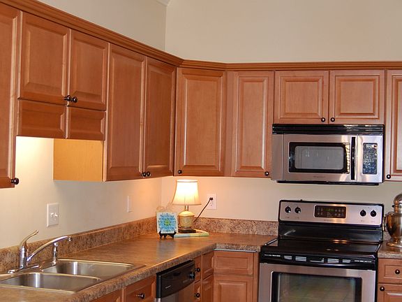 Updated kitchen with stainless steel appliances and vaulted ceiling