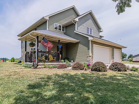 The front porch is the perfect spot for morning coffee or watching the sunset over the pond while listening to the birds and frogs