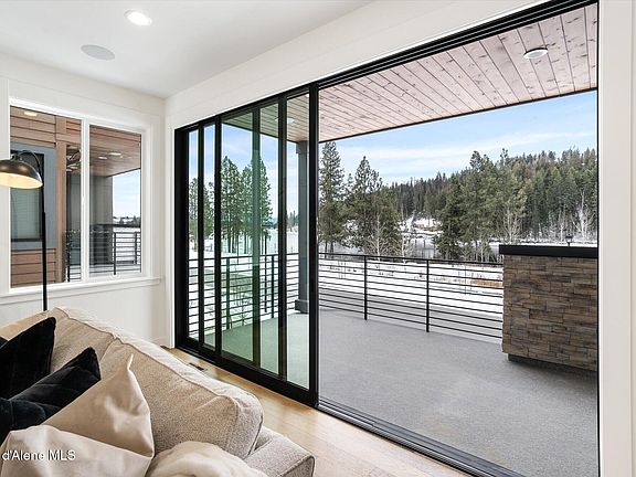 Multi-panel sliders opening onto covered balcony>