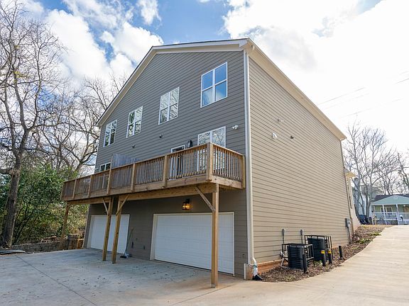 Back of house - 2 car garage and private balcony