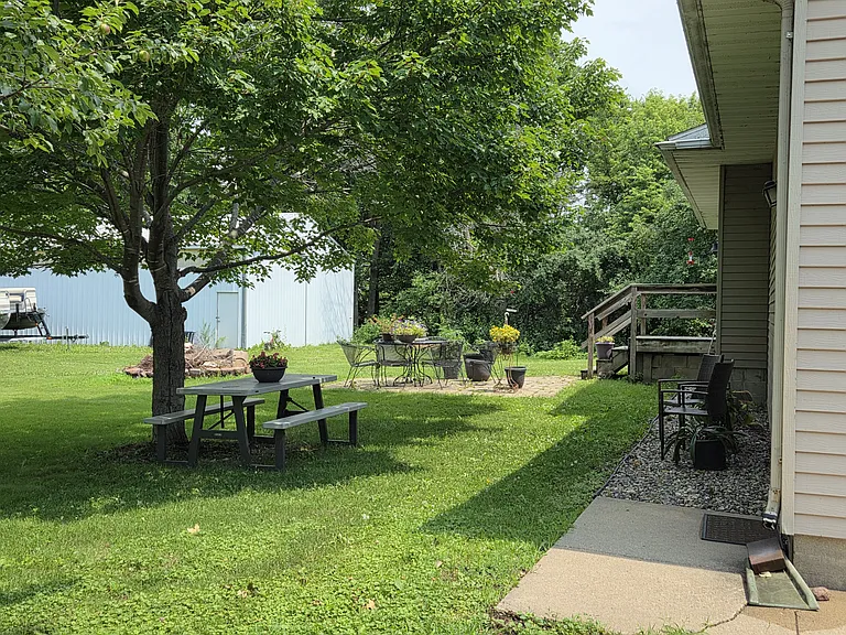 Large backyard w/ firepit and room for storage.