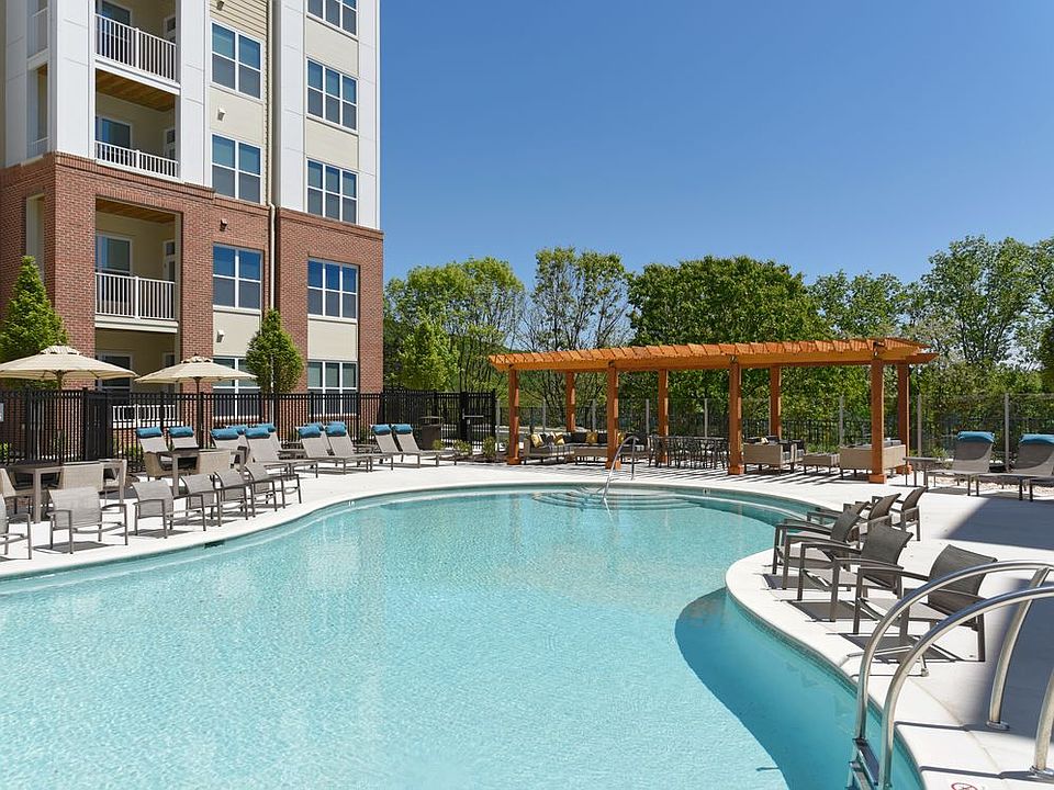 Swimming pool and sundeck with lounge seating