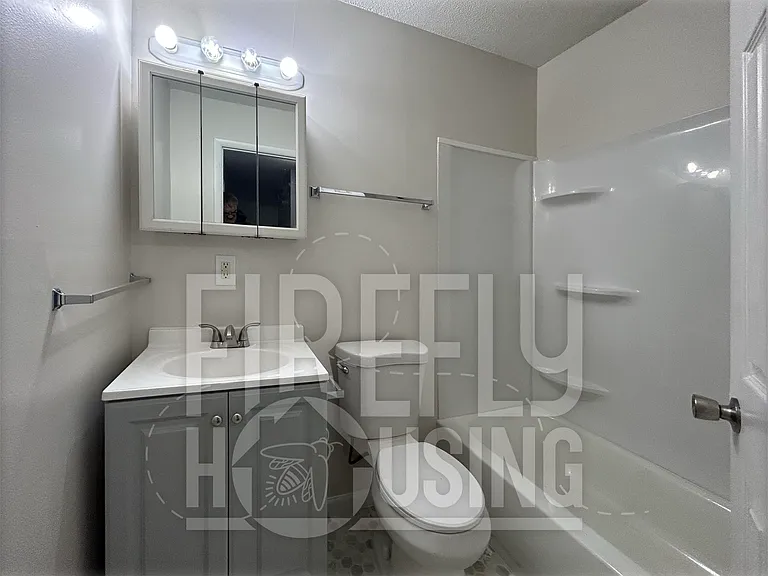 Upstairs Full Bath newly renovated viewed from Hallway.