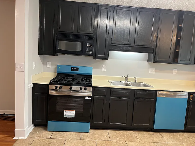 New gas stove and dishwasher in kitchen. Side by side fridge. New counter top being installed in a week.
Blue color is just the packaging and peels off.