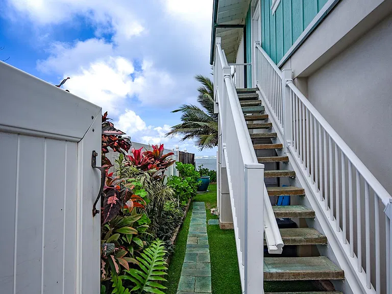 Gate and stairs to the cottage. The path way goes to the steps to the beach.