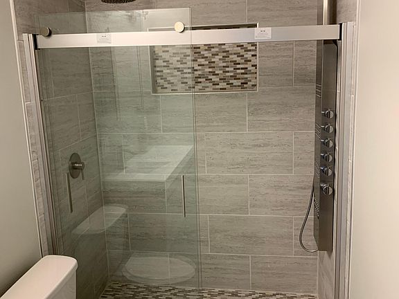 Downstairs master bath double walk-in shower.