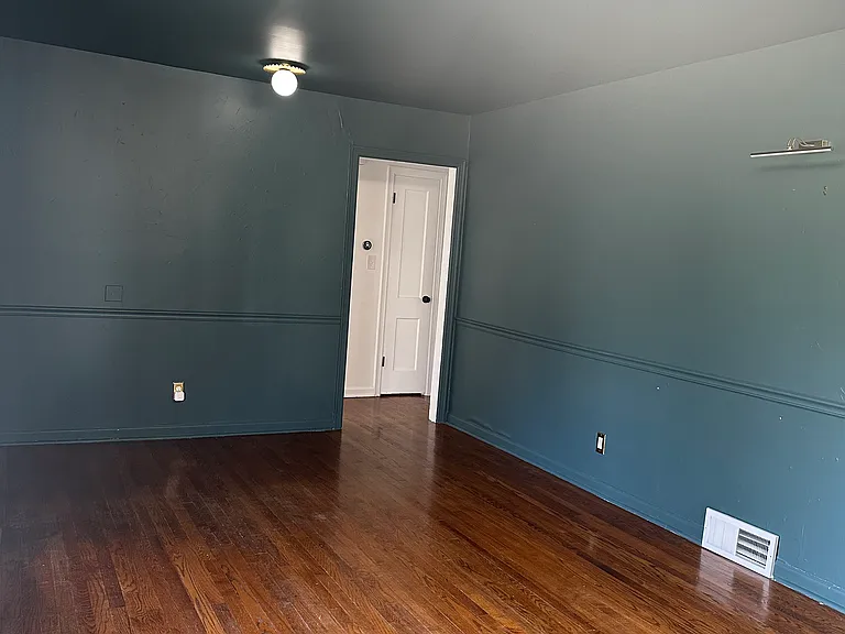 Living room to bedroom hallway, featuring upgraded lighting