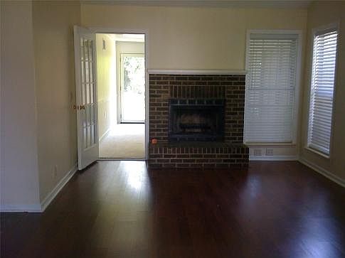 Living room opens to big sunroom
