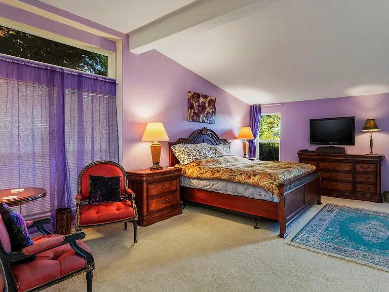 Main spacious bedroom with a king bed