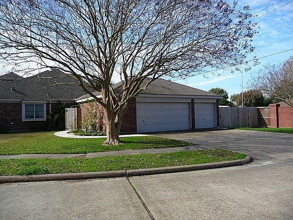 View of side with 3 car garage