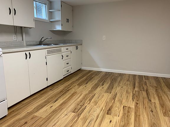 Another view of the kitchen, with lots of room for a large table to eat, or do homework.