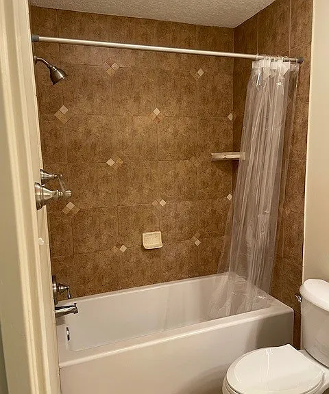 Master tub/shower combo, deep tub for soaking.
