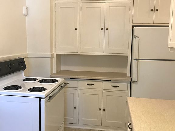 KITCHEN - stove / cabinets / refrigerator