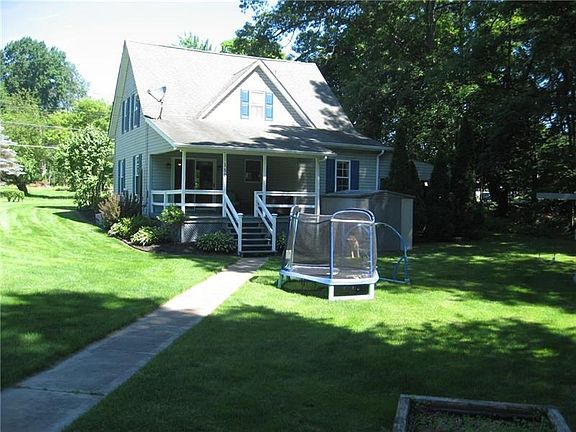 BACK OF THE HOME FEATURES BEAUTIFUL COVERED BACK DECK TO RELAX AND ENJOY THE SUMMER DAYS!