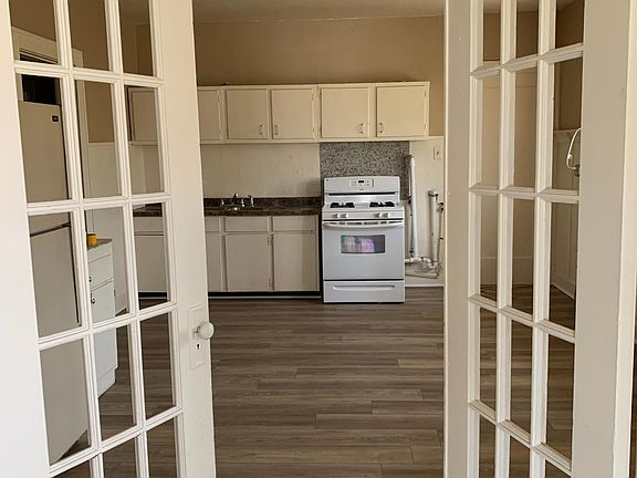 From the living room, looking into the kitchen...stove, frighted, washer and dryer included!