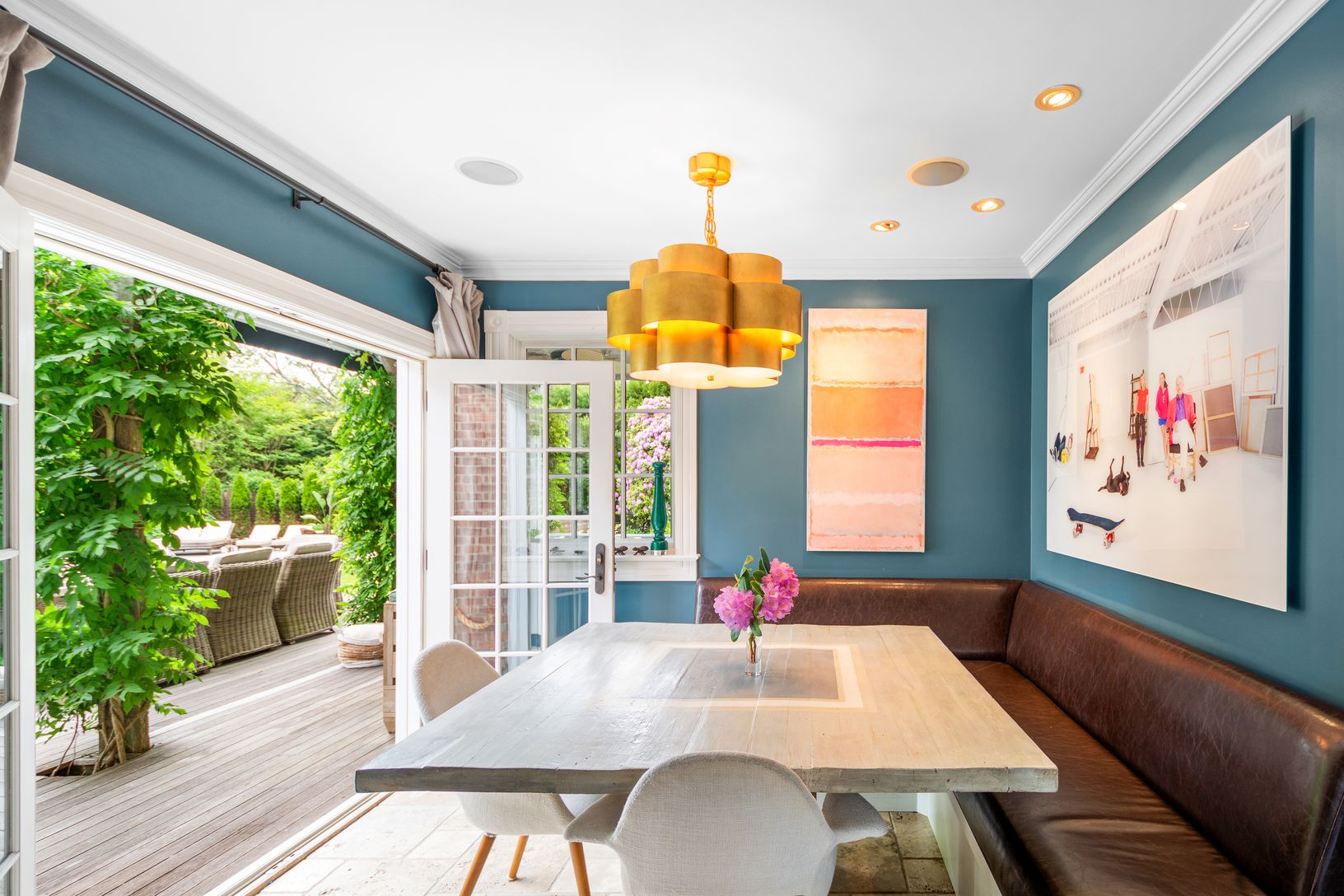  dining area with double doors open to rear deck