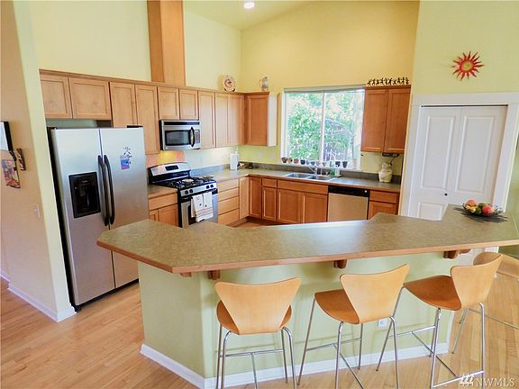 Open and airy entry with den/office to your left and the expansive great room ahead