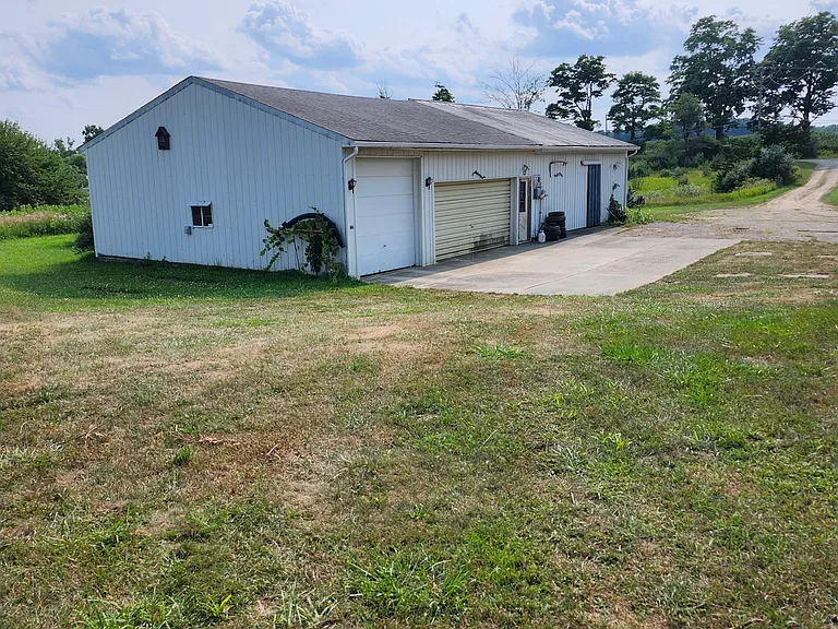 4 car garage and 4-stall barn with hay storage