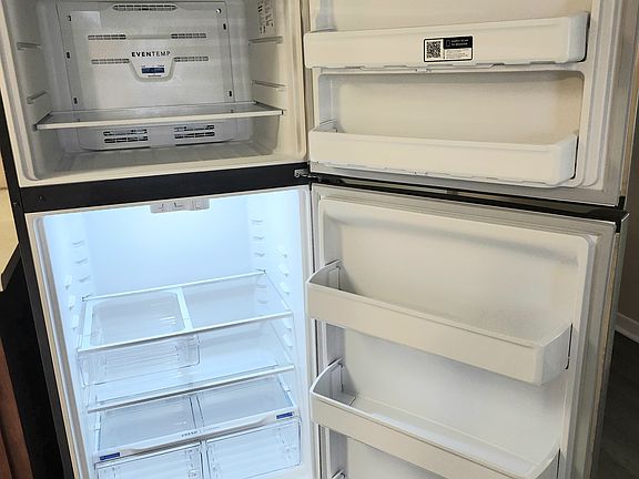Inside of new stainless steel refrigerator