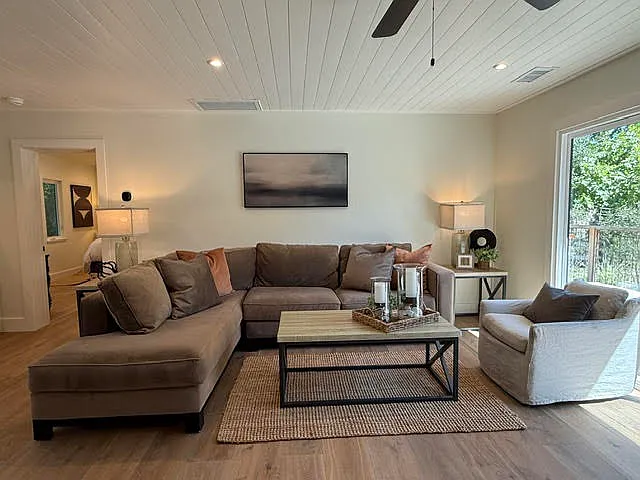 open concept Living Room, sectional sofa, swivel chairs