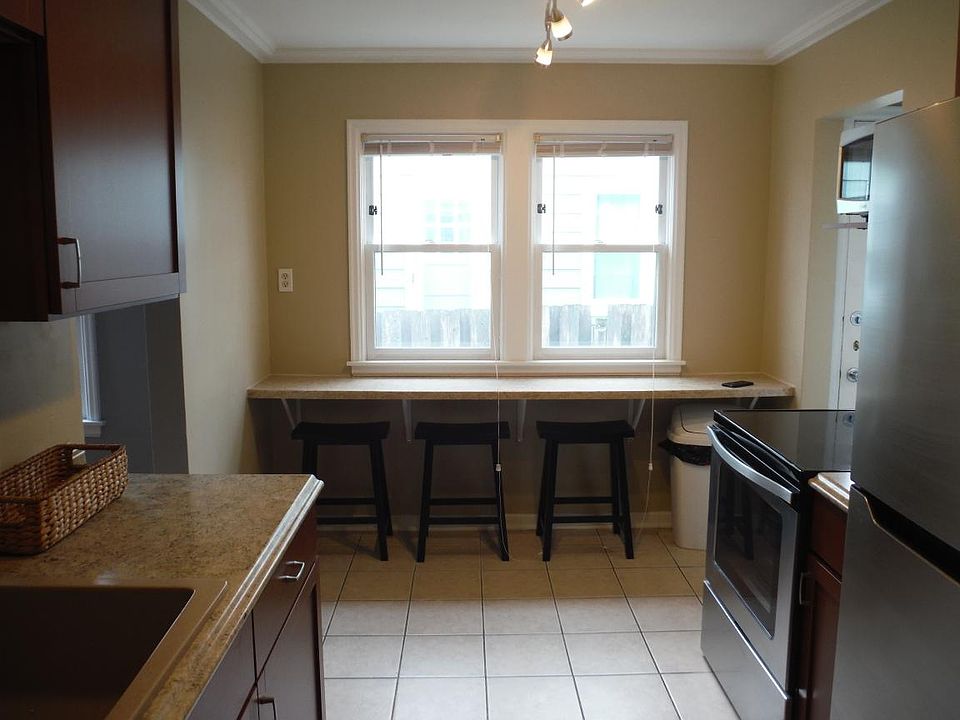 New cabinets, countertops, sink, breakfast bar, applicances, lighting, and paint in kitchen!