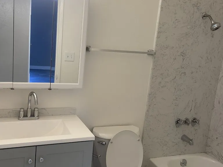 Step into beautifully upgraded bathrooms featuring granite shower enclosures, triplicate vanity mirrors, upgraded faucets, and modern cabinetry.
