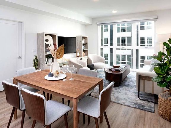 Relax in style with features like oversized windows and wood plank-style flooring that create an everyday escape