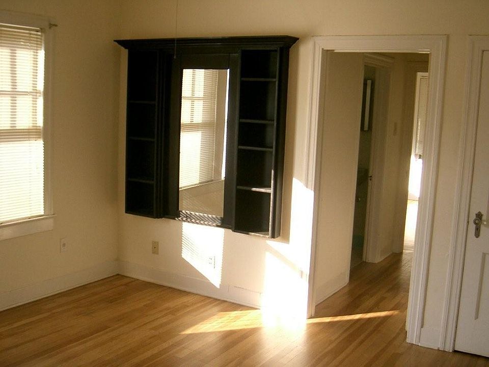 Front bedroom with built in shelving and mirror