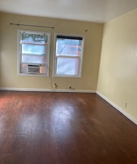 Spacious living room with air conditioner