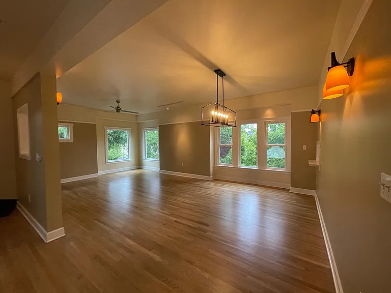 Bright, spacious great room is private and sits high above the street