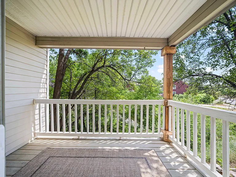 back porch overlooking bike path and green area.