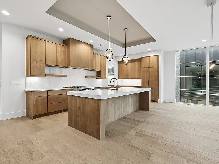 chef's kitchen with oversized island and ample prep space