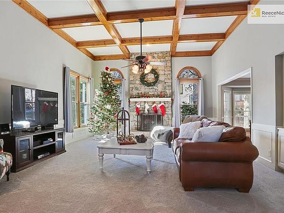 Gorgeous & spacious great room featuring box beam ceilings