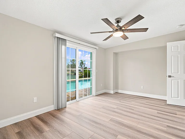 Primary Bedroom overlooking Pool