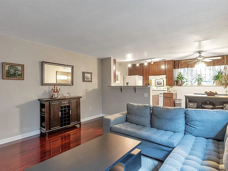 Living room and kitchen. Example prior furnishing. Please note that the Condo is unfurnished.